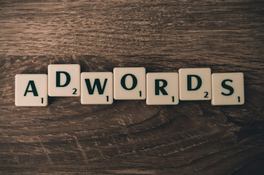 pexels photo 267401 267401 Scrabble tiles spelling 'AdWords' on a wooden surface, symbolizing digital marketing concepts.